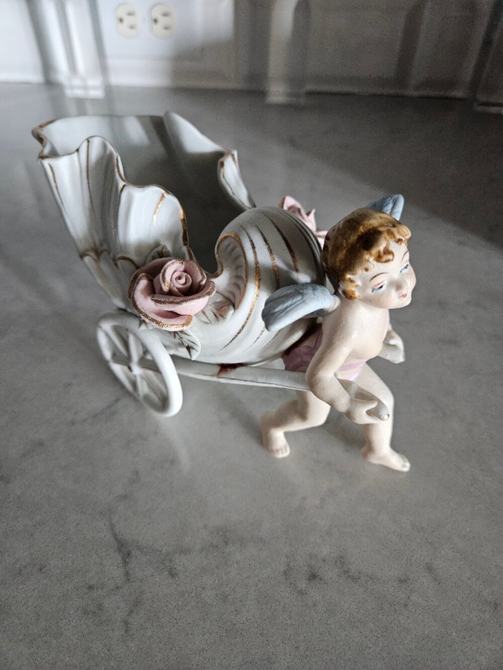 RARE AND VINTAGE UCAGCO CHINA CERAMIC WINGED CHERUB PULLING A SHELL-SHAPED CART